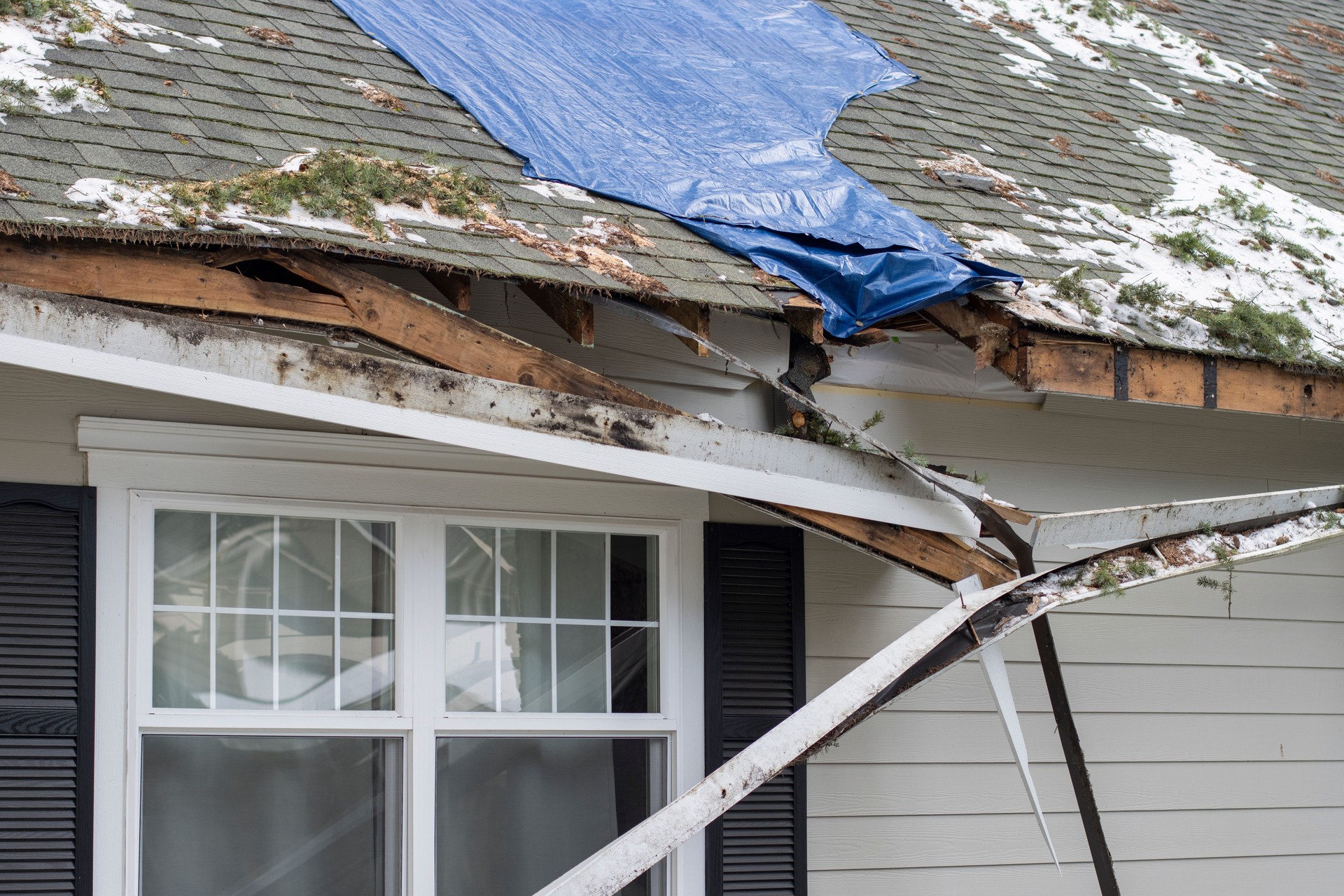 Damaged Rooftop During Winter Storm